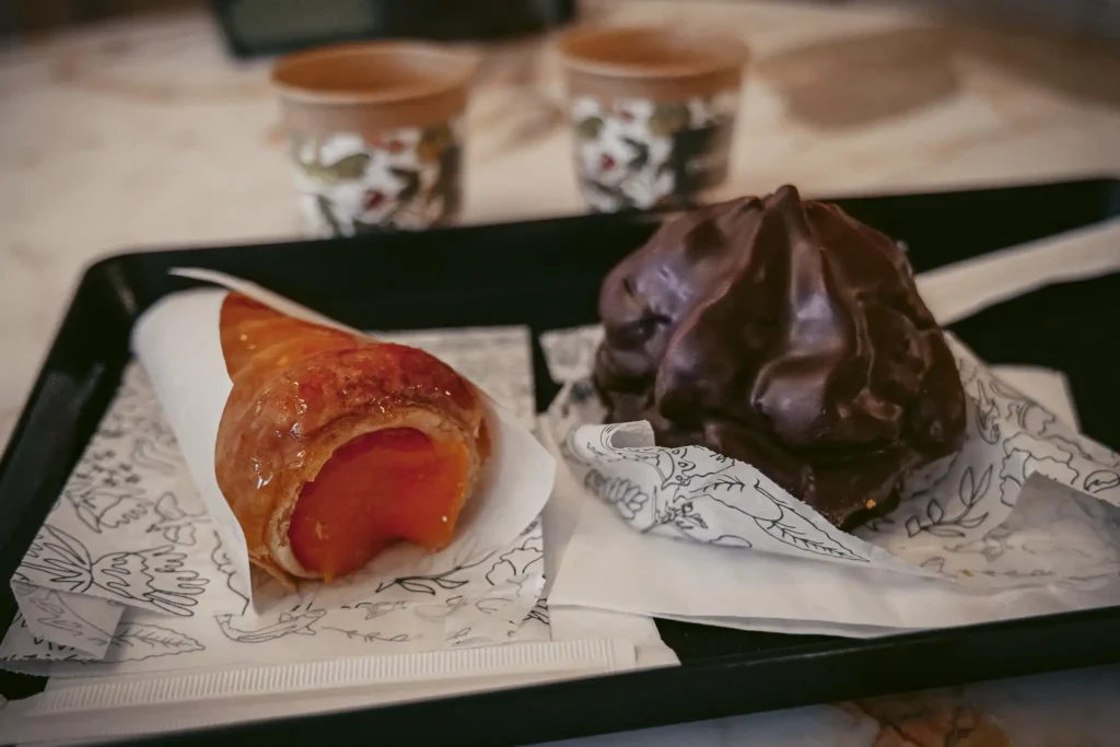 Traditional pastries at Confeitaria Peixinho, Aveiro, Portugal, warm and indulgent atmosphere.