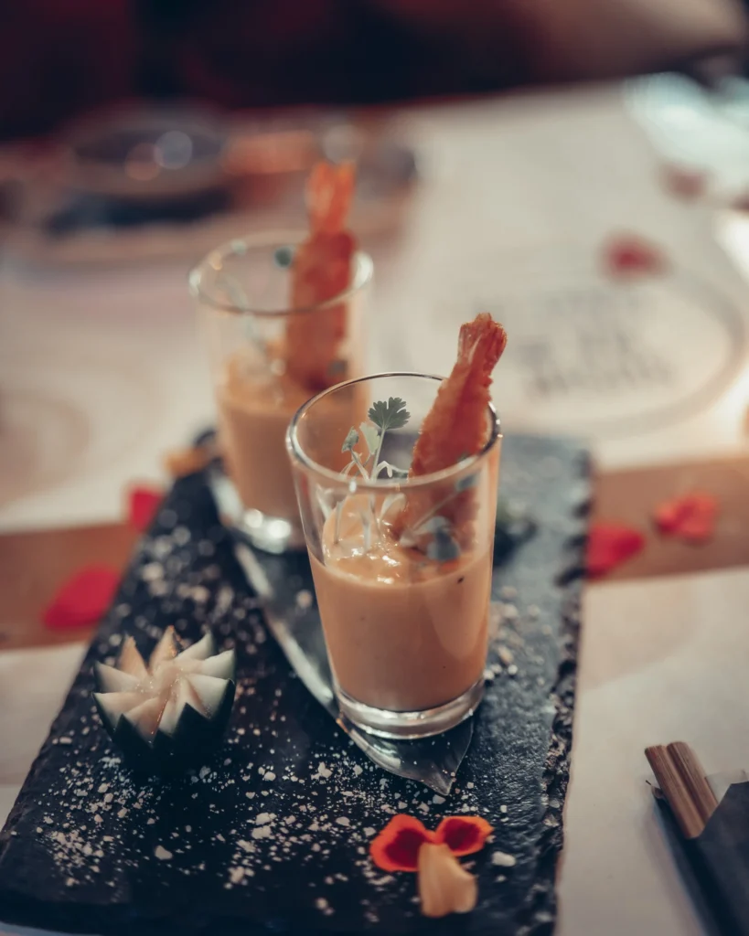 Two shrimp cocktails in glasses on a slate platter at Sushi na Gaveta, Tavira, Algarve, Portugal.