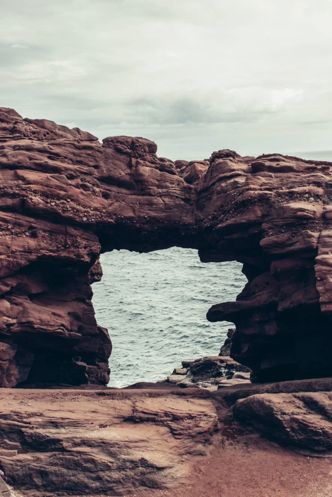 Natural rock formation in an arch on the coast of Arbroath in Scotland