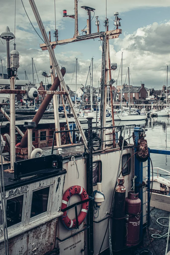 Fishing boat in the port of Arbroath with marine equipment and nets