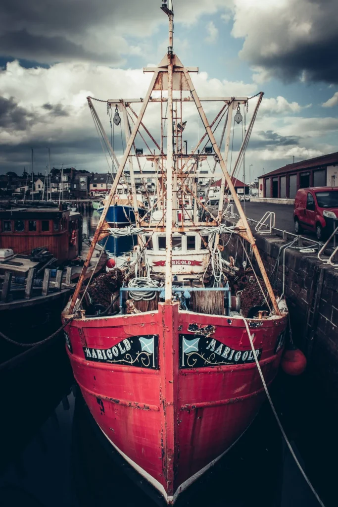 The red fishing boat Marigold docked in the harbor of Arbroath in Scotland