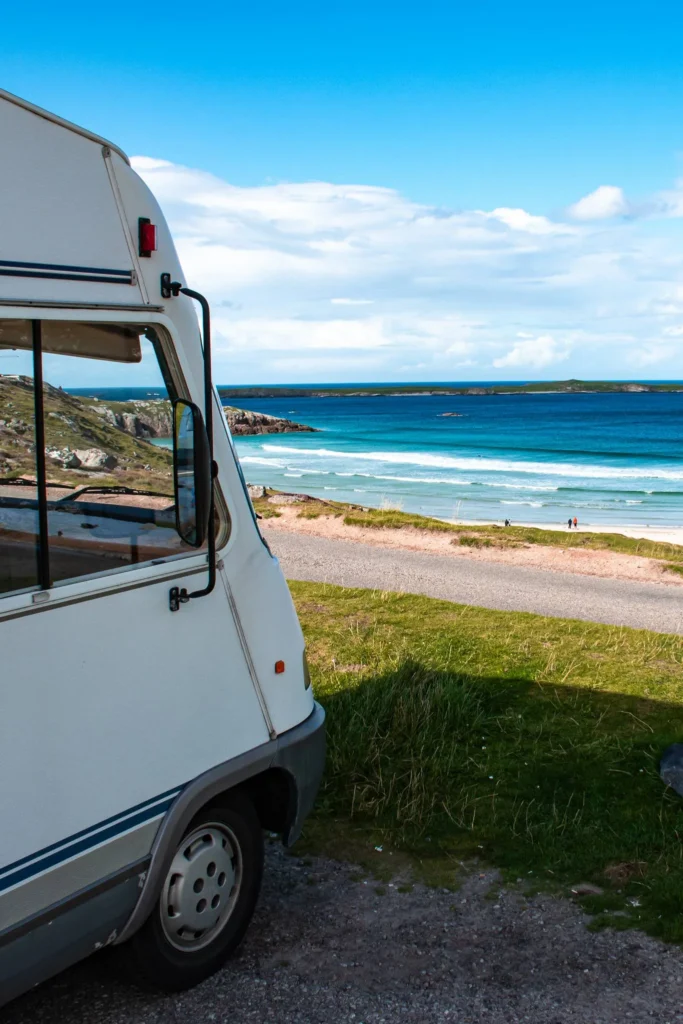 Camper van overlooking Sangomore beach turquoise sea