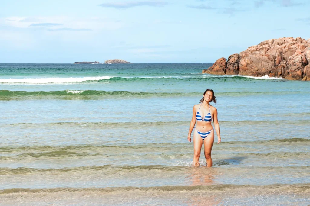 Caroline swimming Sangomore Beach Durness rocks