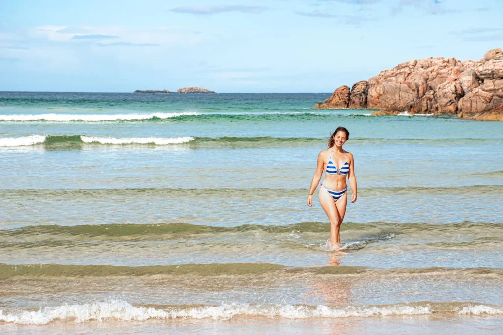 Caroline walks water Sangomore Beach Durness
