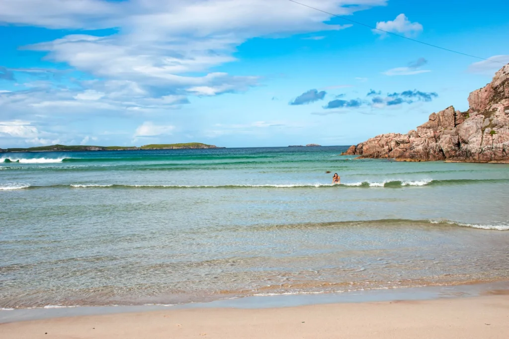Sangomore Beach Durness clear water rocks blue sky