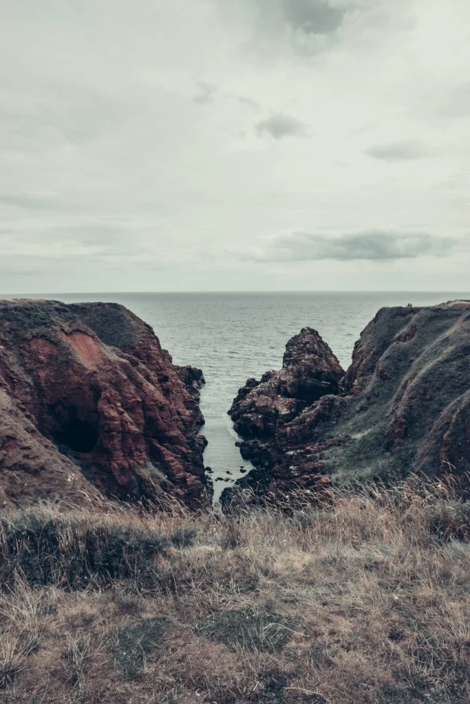 Red sandstone cliffs overlooking the North Sea in Arbroath
