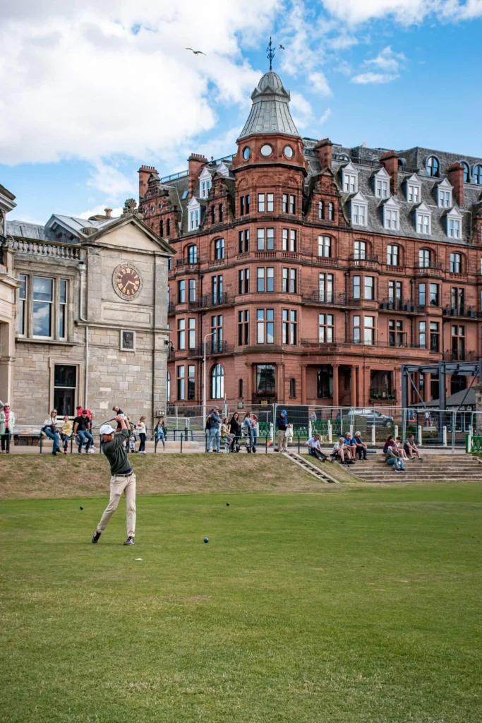 Golfer makes a swing on the historic St Andrews course