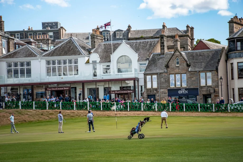 Golf green at St Andrews with several golfers in action
