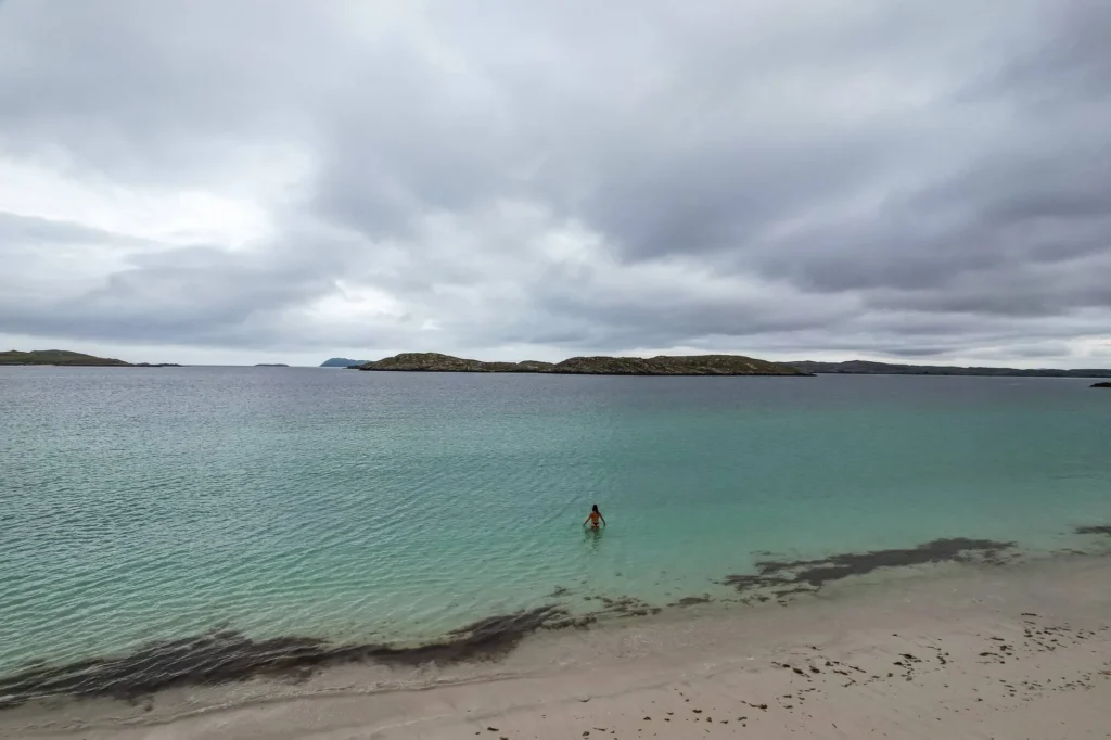 Caroline swimming turquoise water beach Isle of Harris
