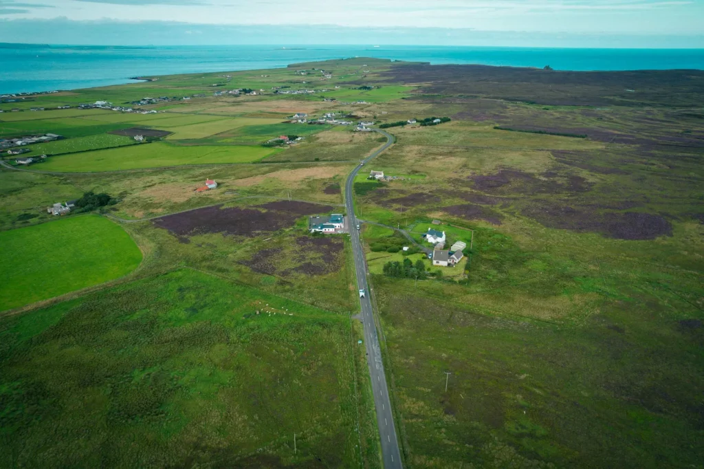 Aerial view of the lush moorland and homes near John o'Groats