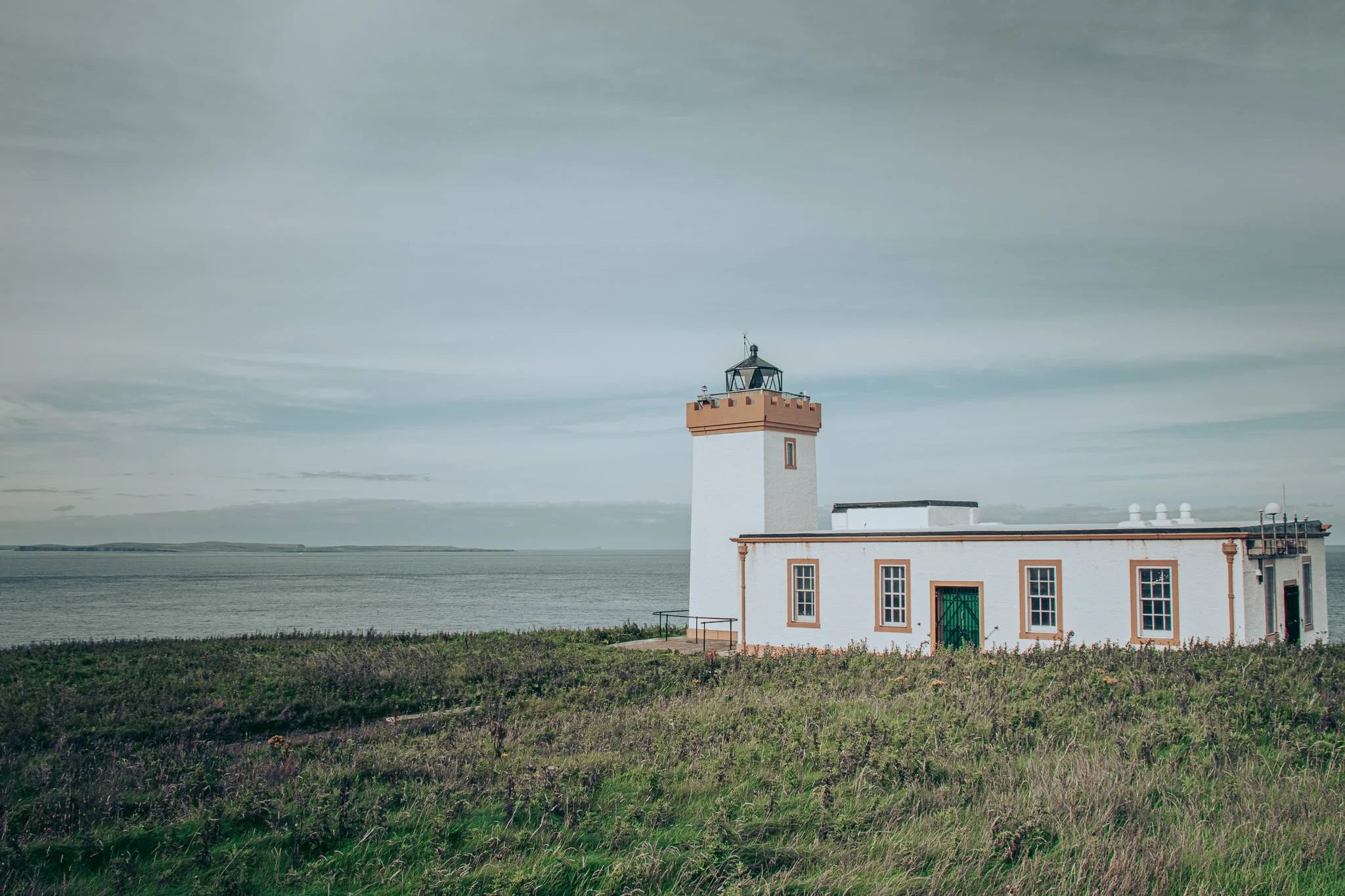 White lighthouse John O'Groats coastal plain northern Scotland