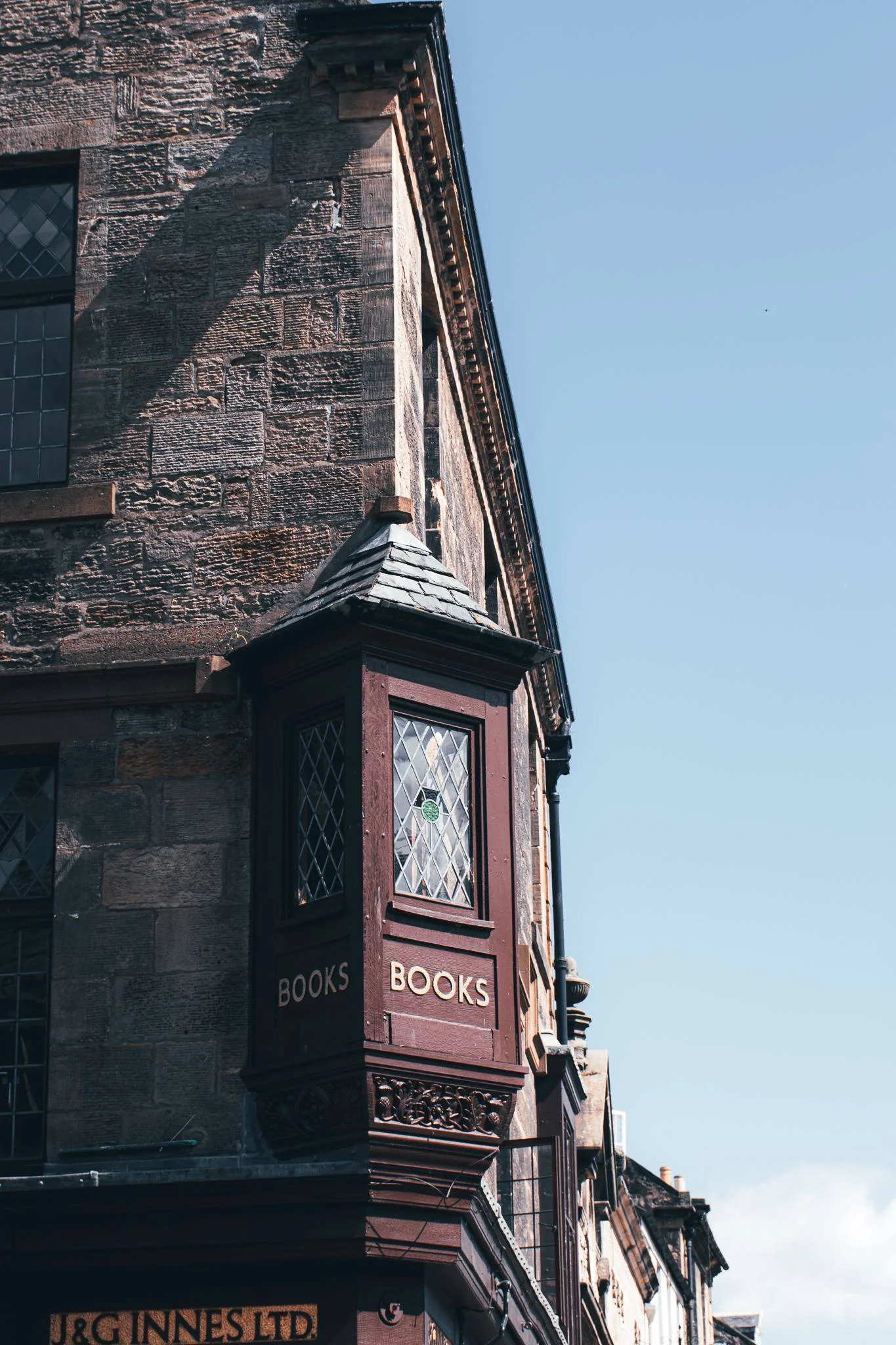 Facade of an old bookstore in St Andrews with the sign BOOKS