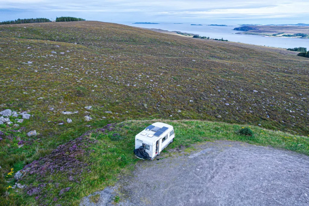 Isolated campervan hill Loch Broom Scotland