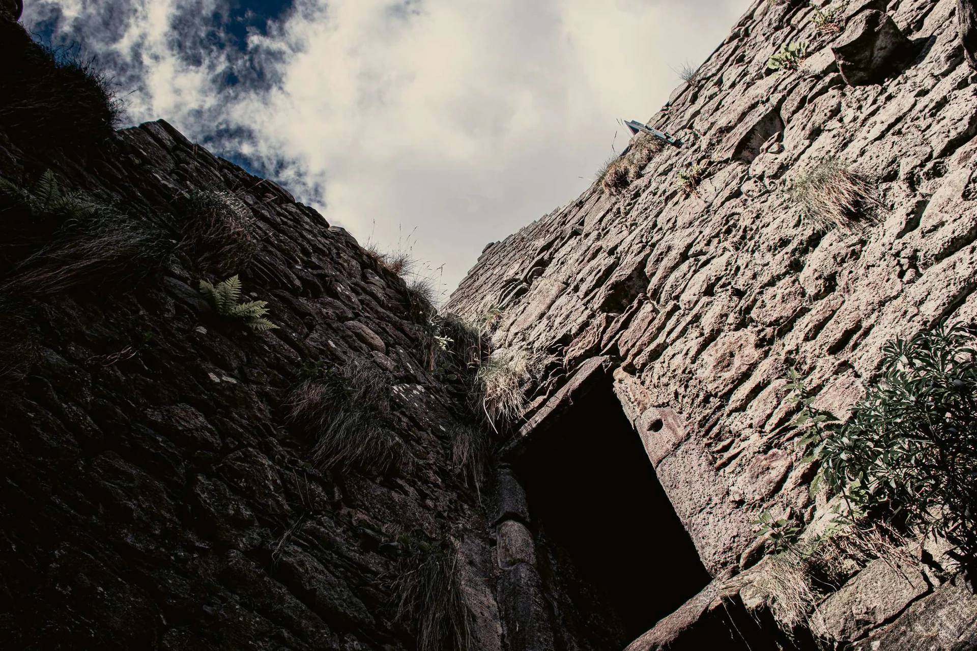 View from below of the stone walls of Dunnottar Castle in Scotland