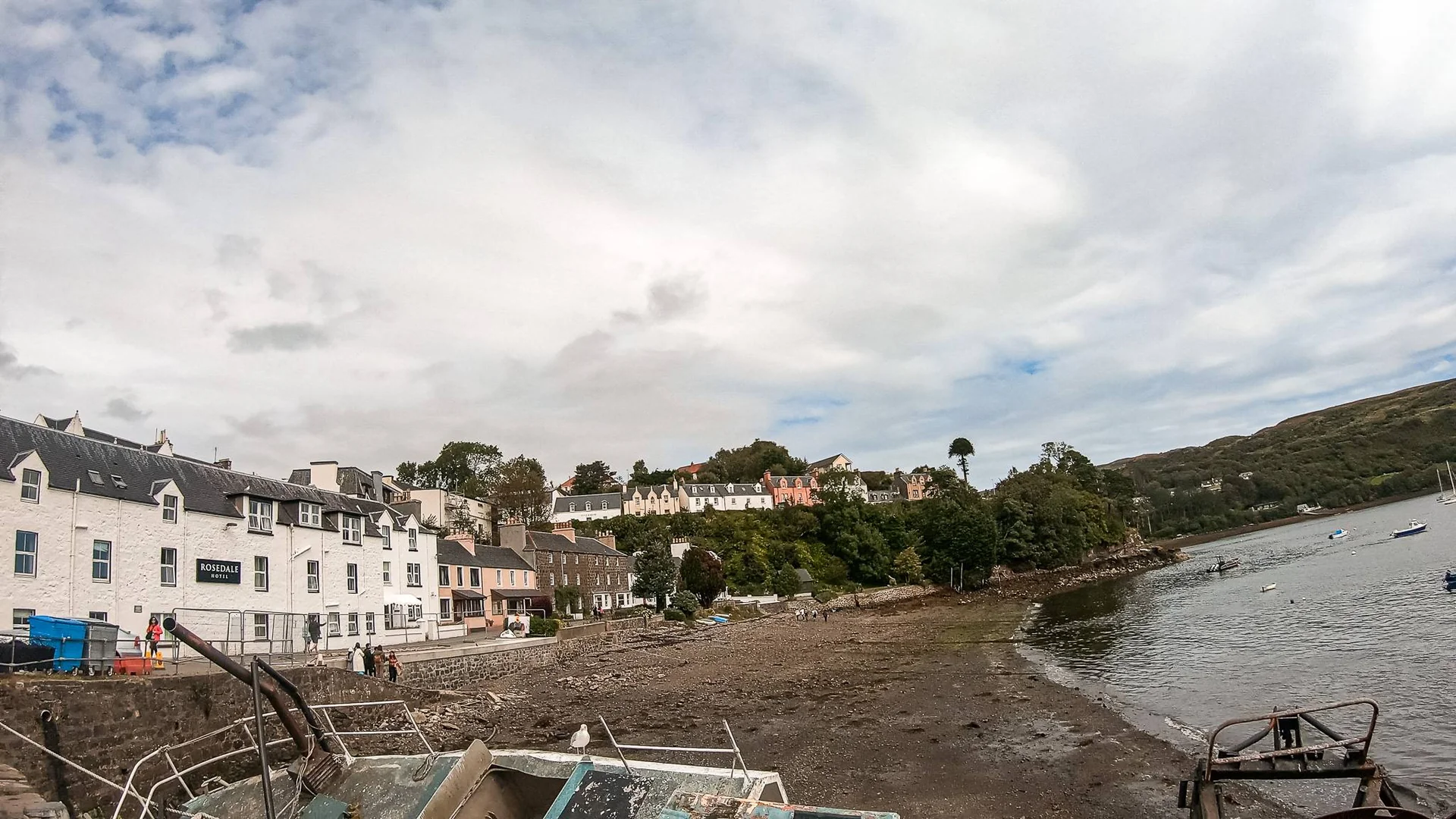 Colorful houses of Portree harbor at low tide Isle of Skye