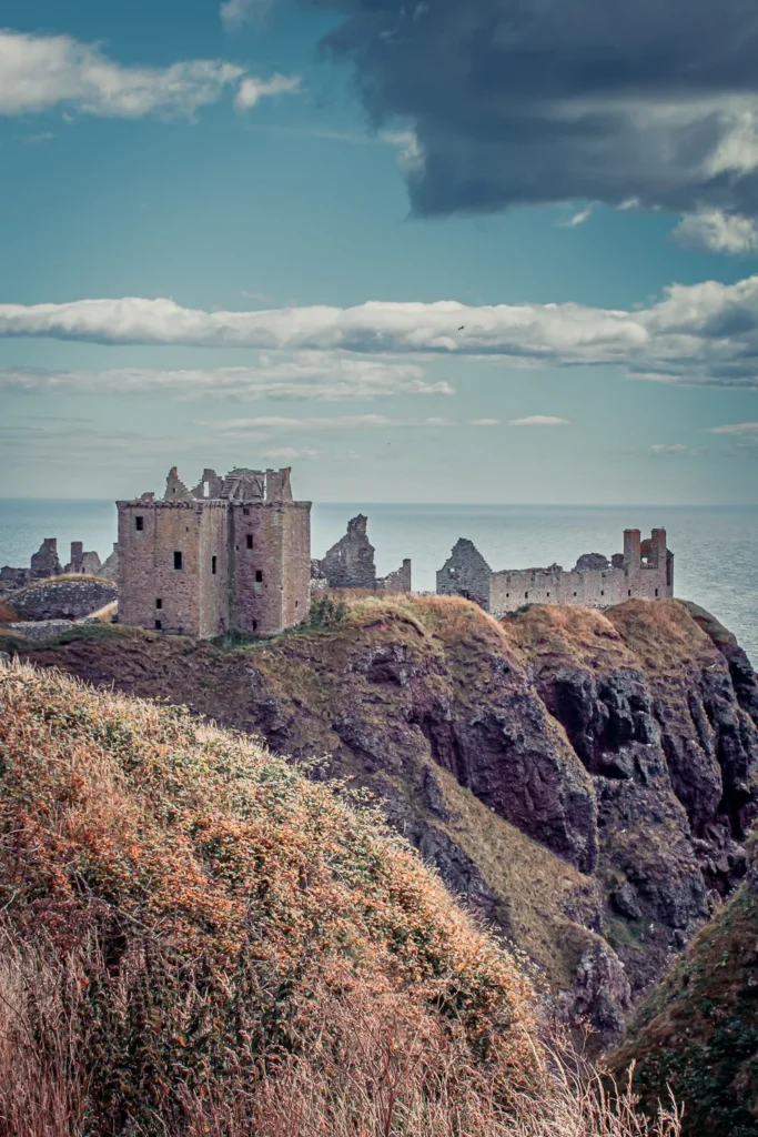 Ruins of Dunnottar Castle overlooking the North Sea on a cloudy day