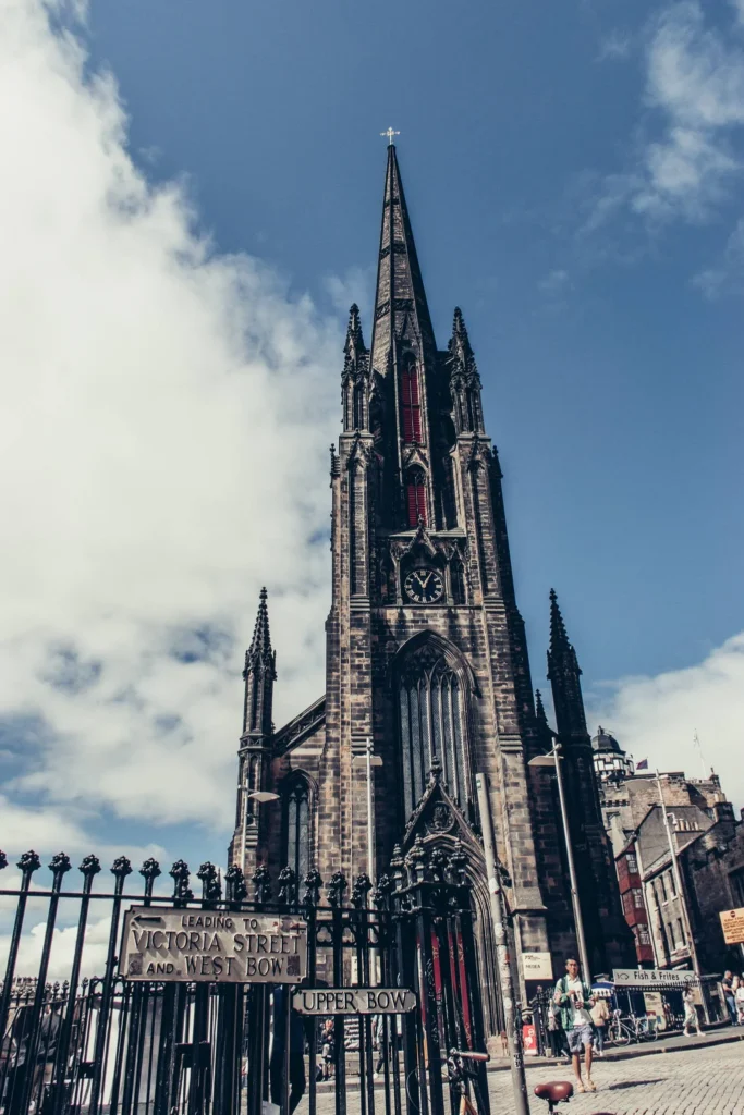 Neo-Gothic facade of The Hub in Edinburgh, Victoria Street and Upper Bow signs
