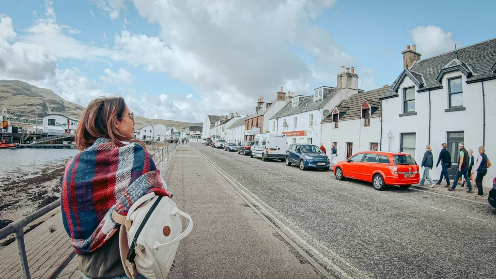 Caroline walks port Ullapool white houses checkered scarf
