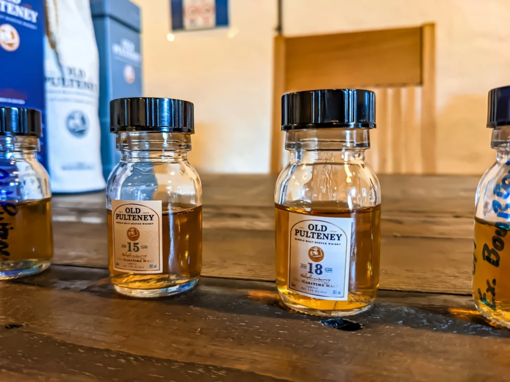 Old Pulteney whisky samples laid out on a wooden table during a tasting at the Old Pulteney distillery in Wick, Scotland, in August.