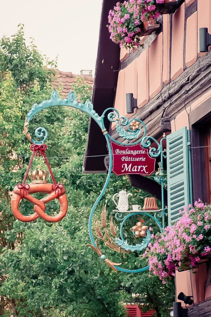 Traditional bakery-pastry shop sign of Marx in Eguisheim, adorned with Alsatian patterns
