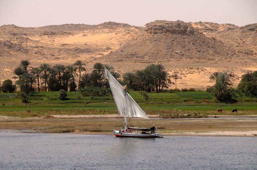 A sailing felucca on the Nile at sunset