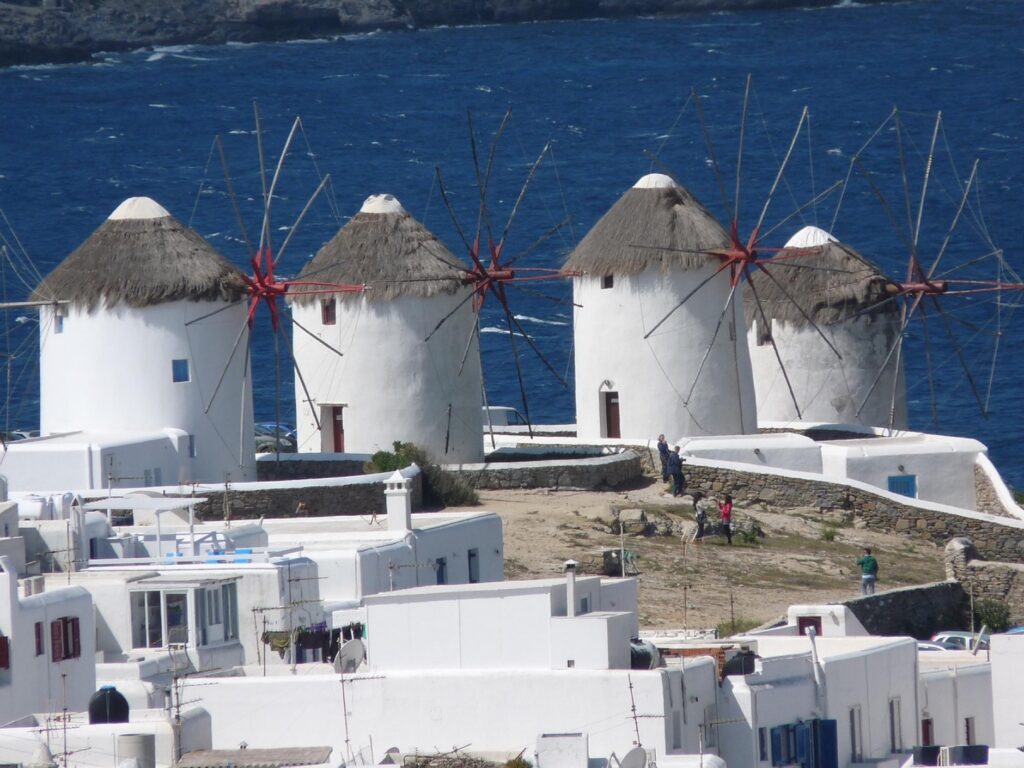 The iconic windmills of Mykonos facing the Aegean Sea