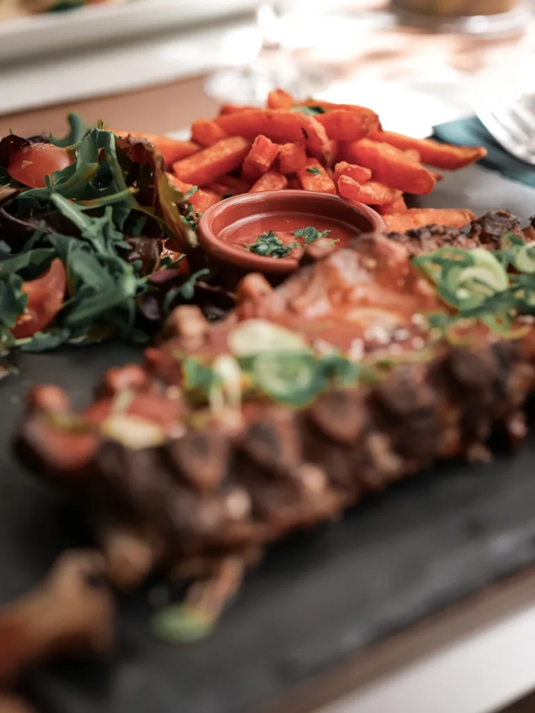 Pork ribs with sweet potato fries at a Tavira restaurant