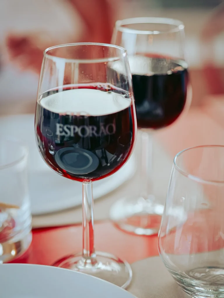 Two glasses of red wine are placed on a table set at the Lumo restaurant in Tavira, Algarve, Portugal, in June 2026.