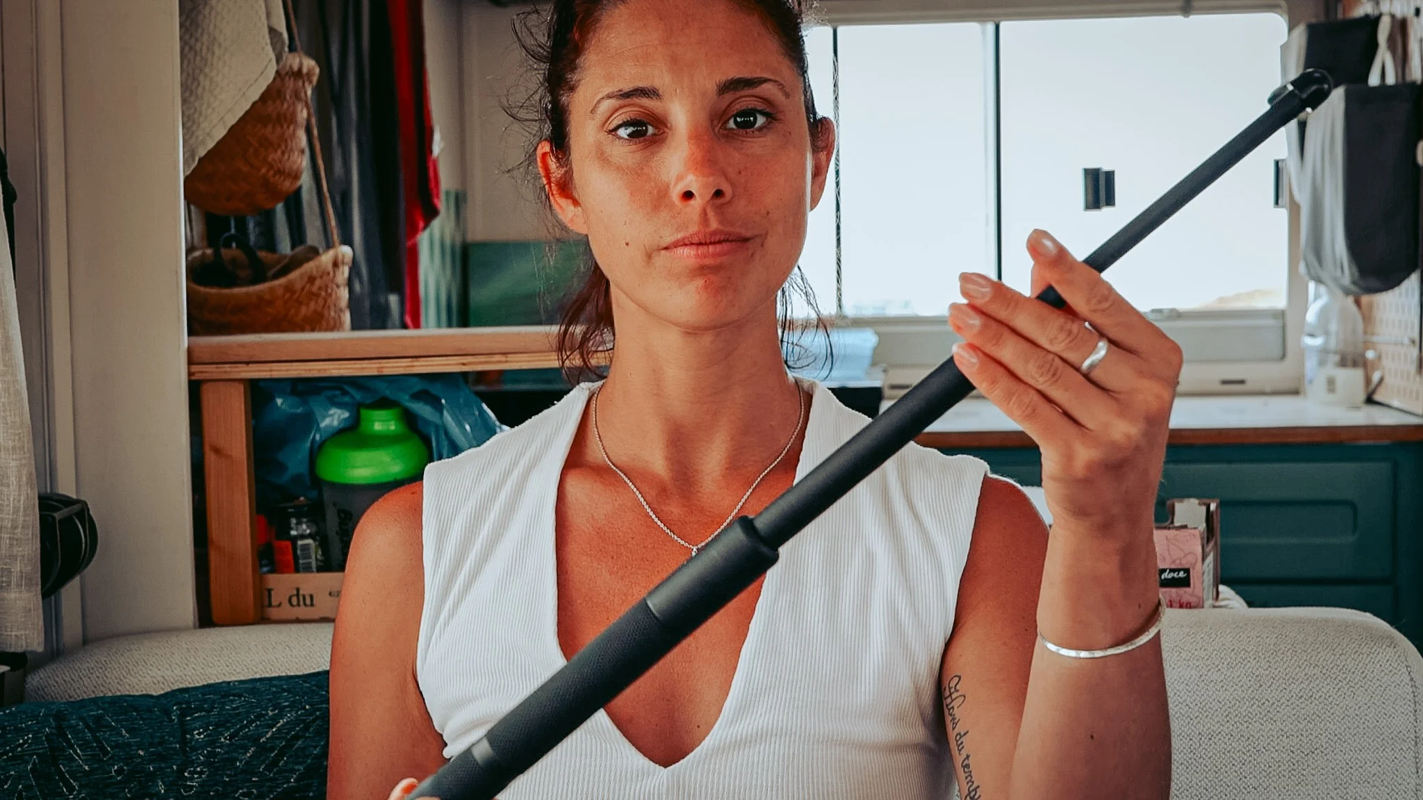 Telescopic baton deployed in a converted van, self-defense in vanlife