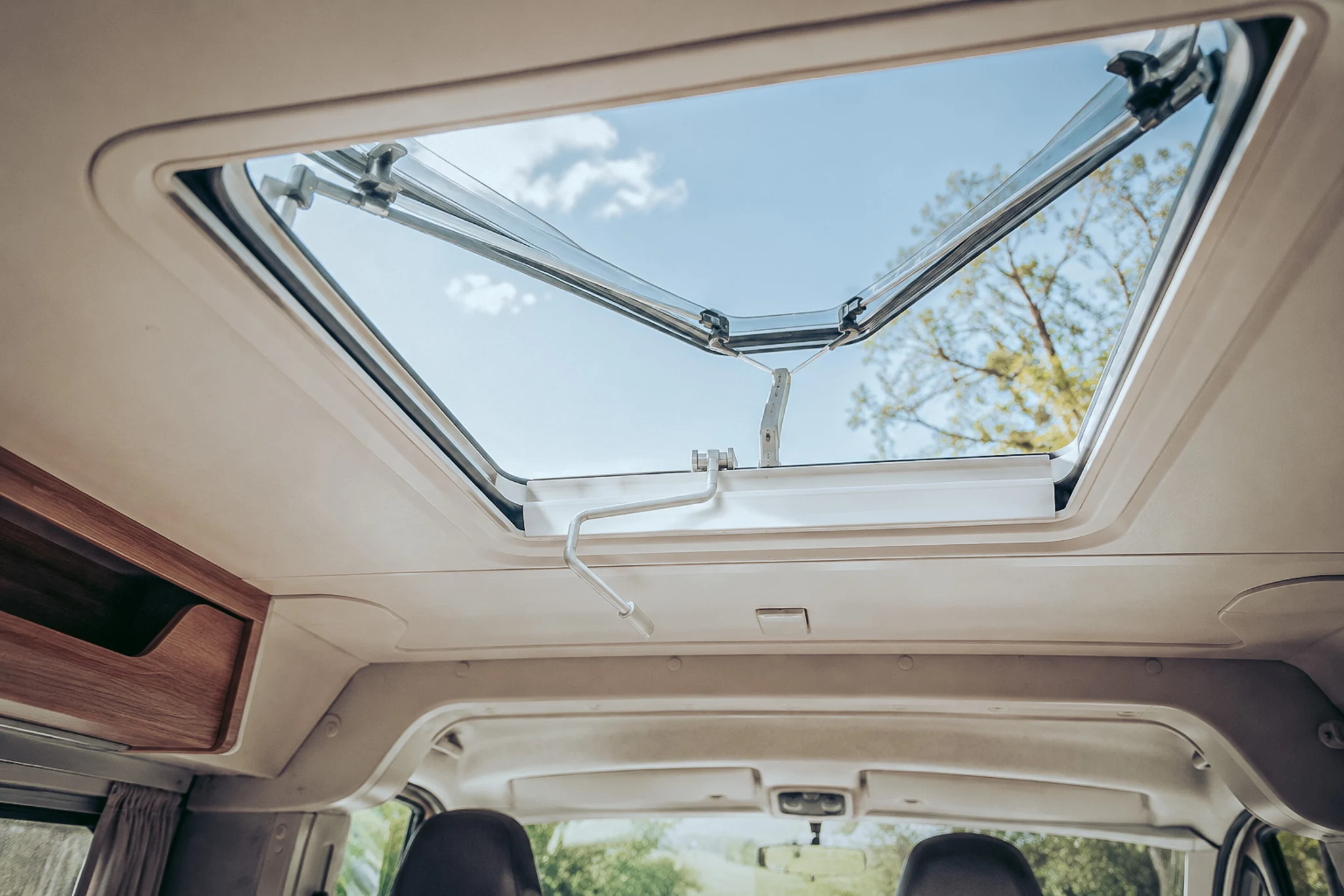 Open roof hatch ensuring high ventilation of a converted van