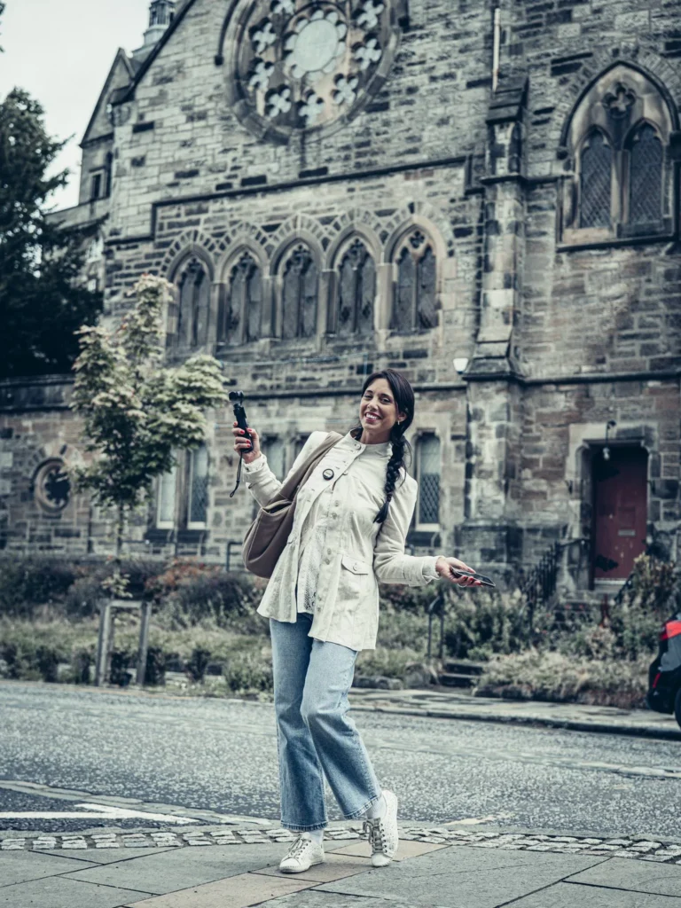 Caroline in front of the Church of the Holy Rude in Stirling, camera in hand.